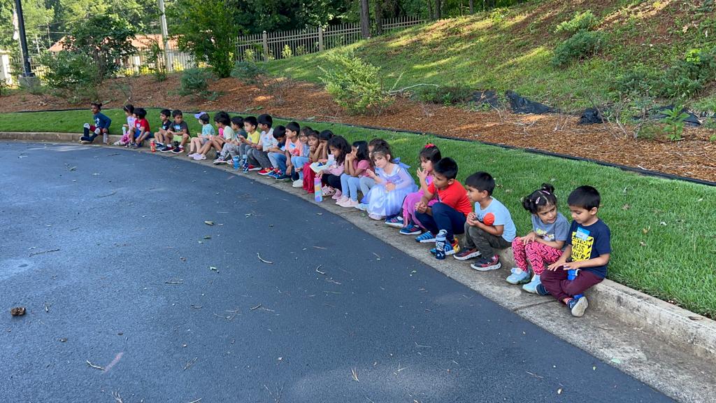 Children sitting together outdoors